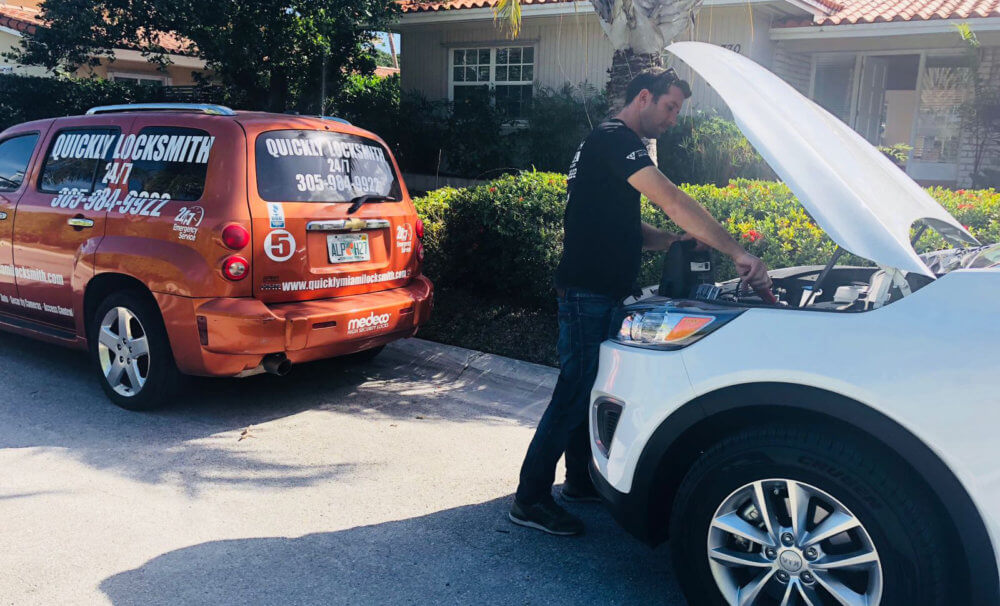 Our locksmith technicians providing roadside assistance services to a car stuck in Miami FL