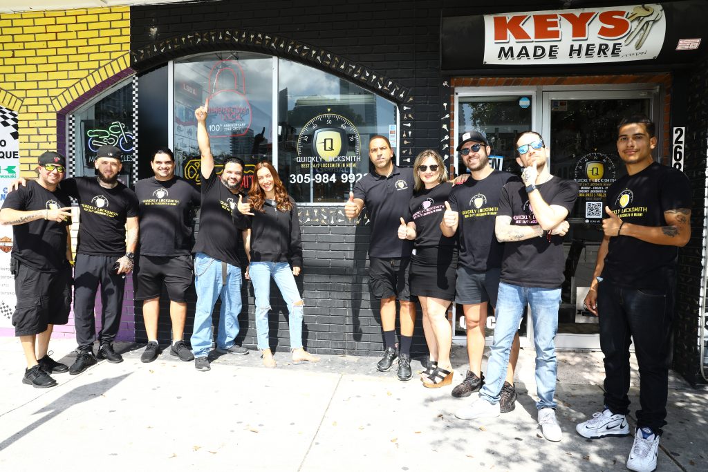 Quickly Locksmith Miami team members outside the store front in Miami downtown