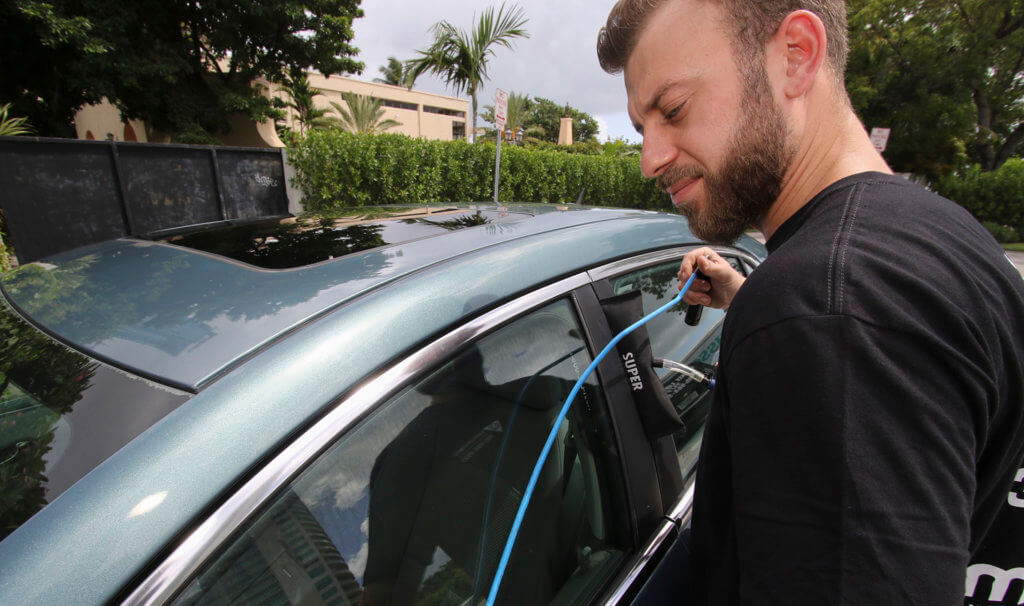 Unlocking locked car in Miami FL using locksmiths Technics for opening the car safely