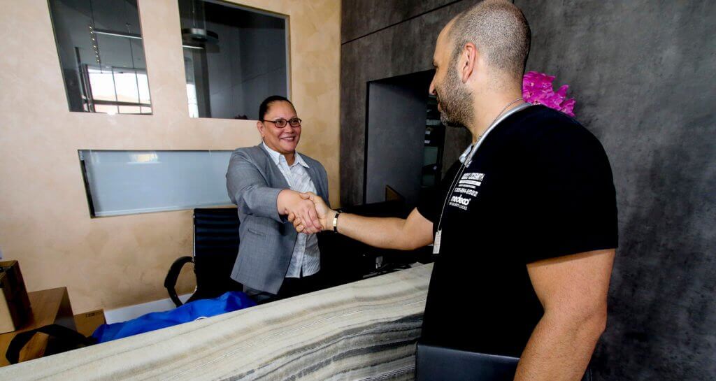 happy client with companies CEO shaking hands