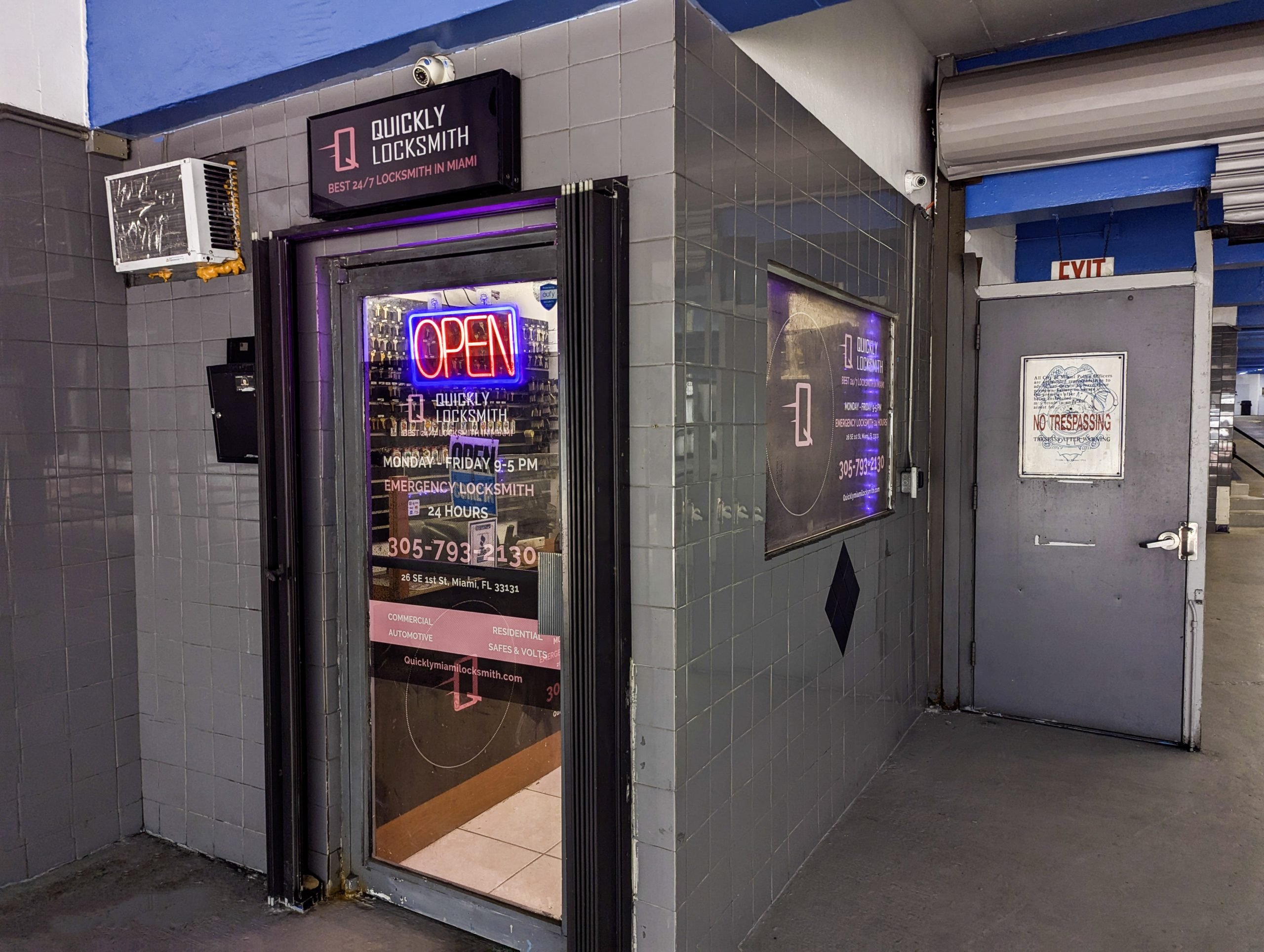 Entrance door to Quickly Locksmith Miami Downtown located inside the parking garage.